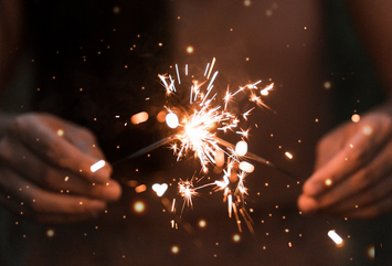 person holding fire works